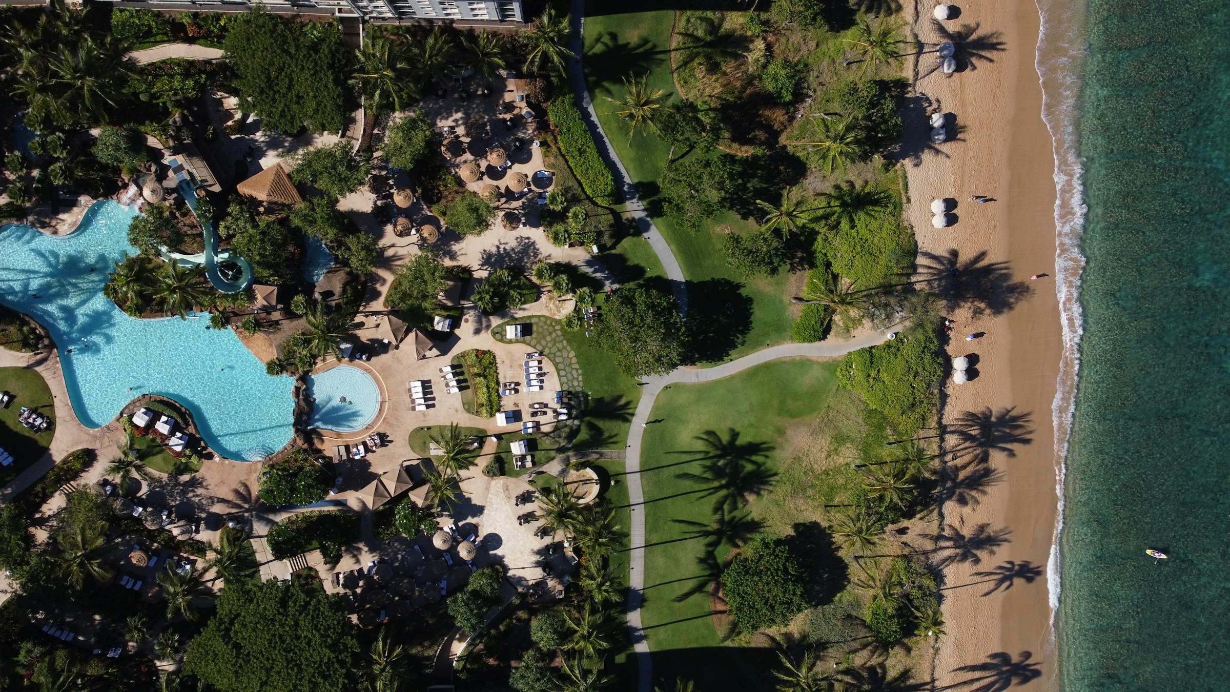 Aerial view of a Maui resort with pool complex and beach