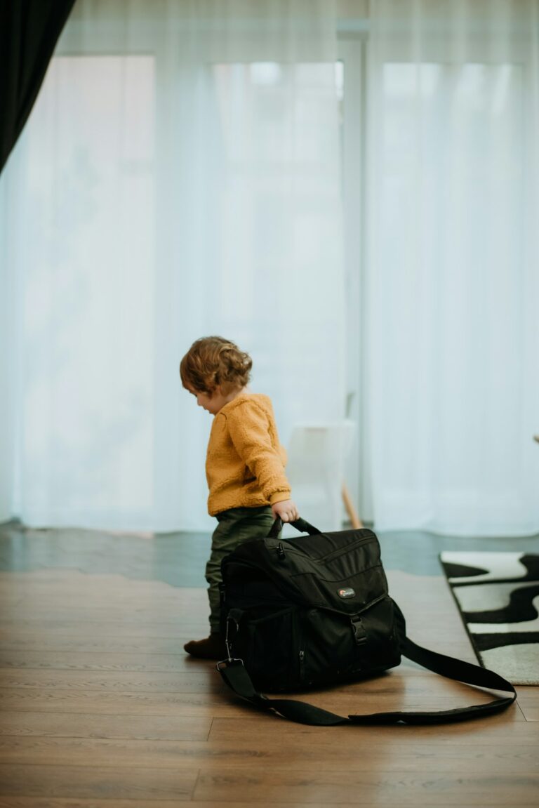Young boy with travel bag and luggage